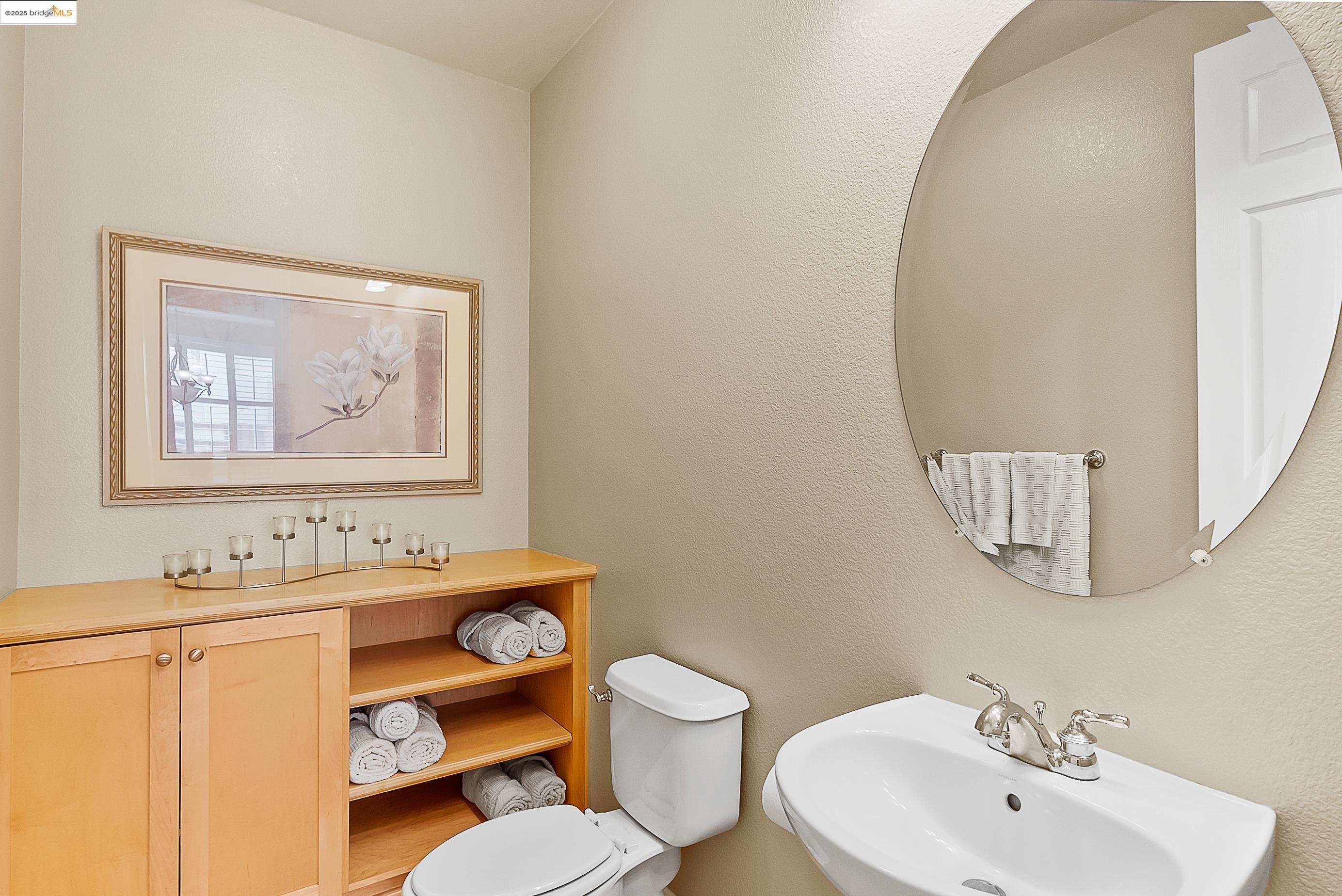 5282 Fern Ridge Circle Discovery Bay, CA 94505 - Photo 20 of 41 a bathroom with a sink mirror and toilet