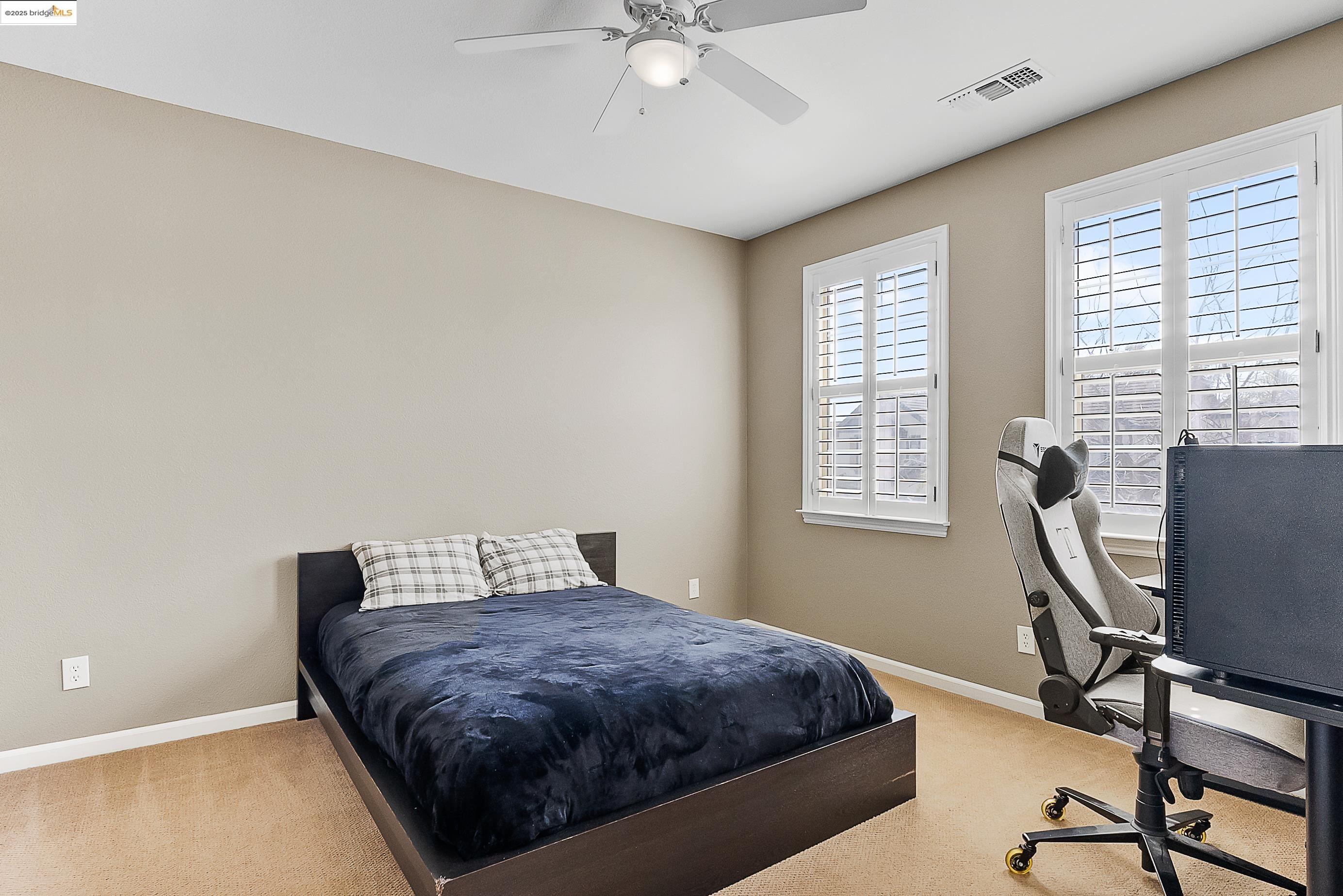 5282 Fern Ridge Circle Discovery Bay, CA 94505 - Photo 25 of 41 a bedroom with a bed and a desk