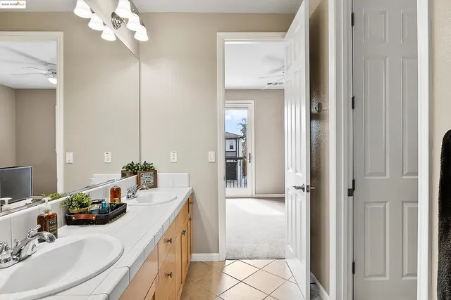 a bathroom with a sink a vanity and a mirror