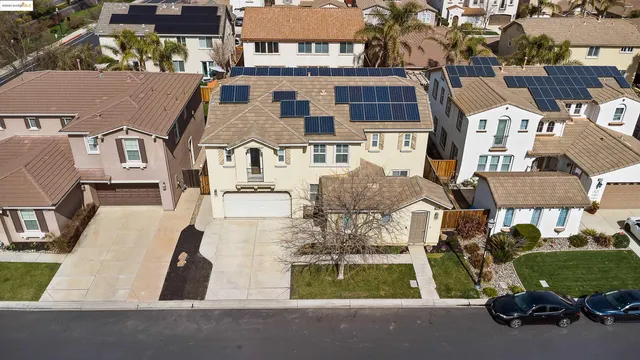 an aerial view of residential houses with outdoor space