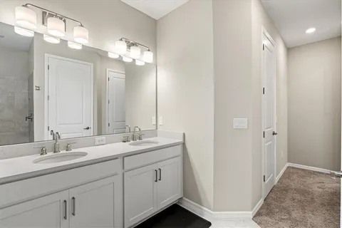 a bed room with a bed and a night stand