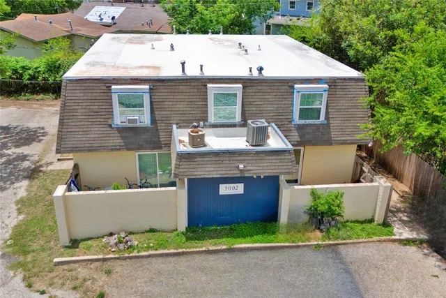 a view of backyard with seating space and yard