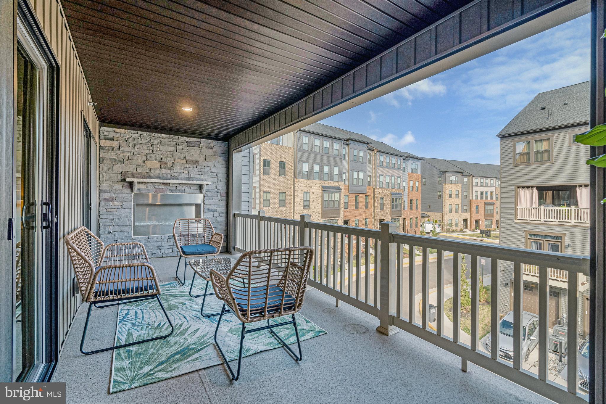 2695 Velocity Road, Unit 49K Herndon, VA 20171 - Photo 17 of 40 Outdoor Fireplace w Stacked Stone