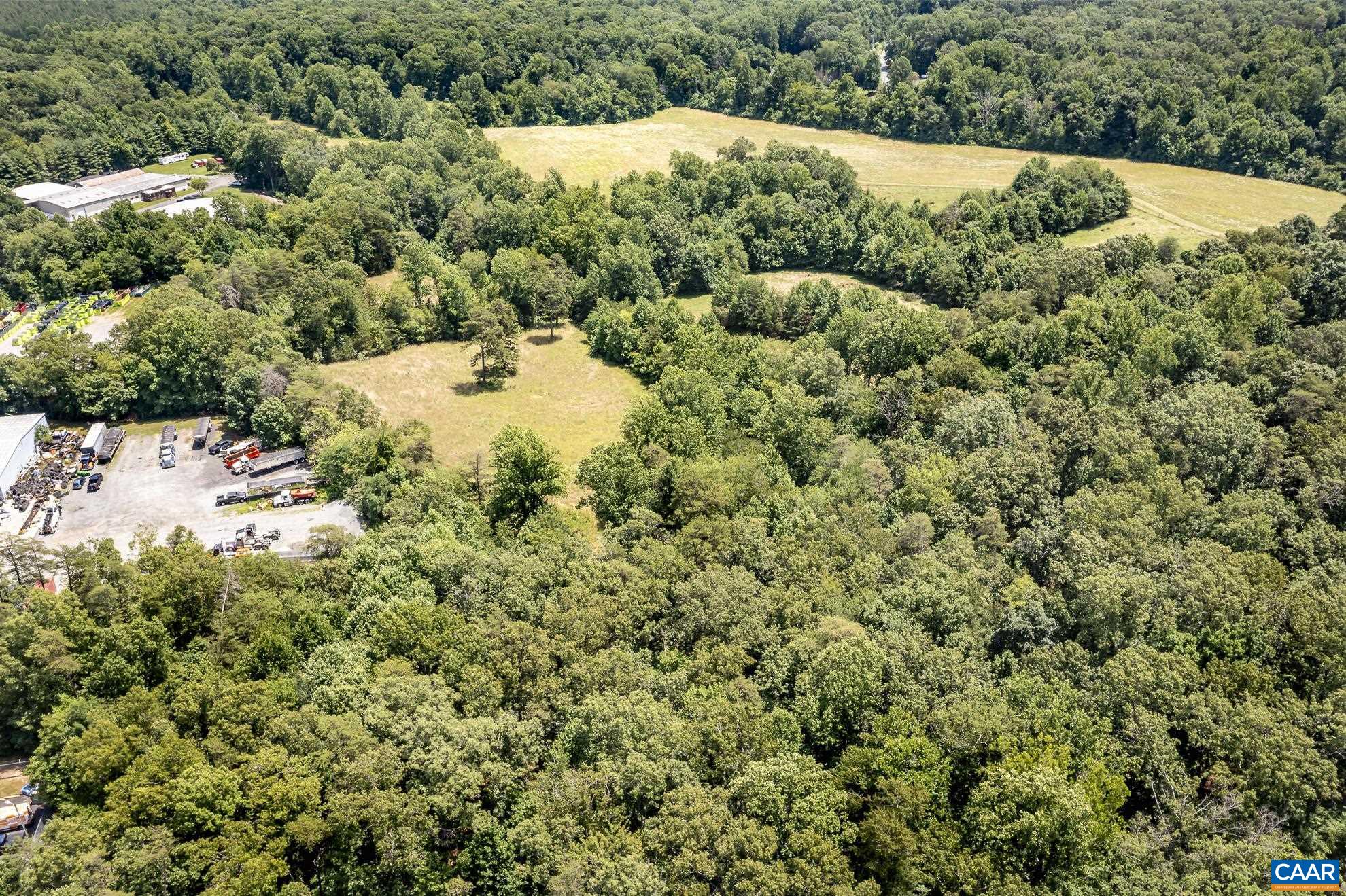 11697 Spotswood Trail Ruckersville, VA 22968 - Photo 13 of 53 a view of a tree in a field of white house