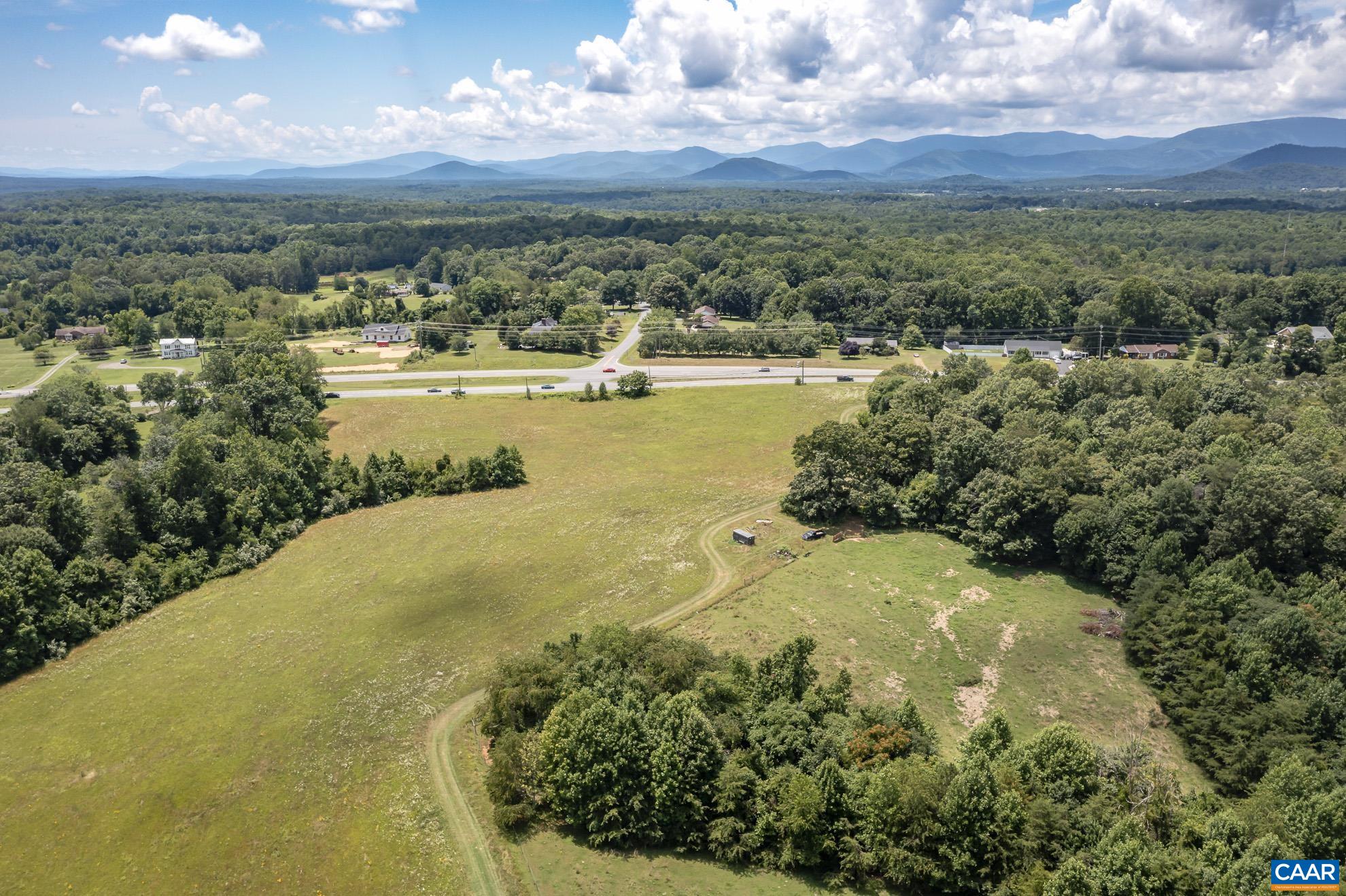 11697 Spotswood Trail Ruckersville, VA 22968 - Photo 14 of 53 a view of a lake with mountains in the background