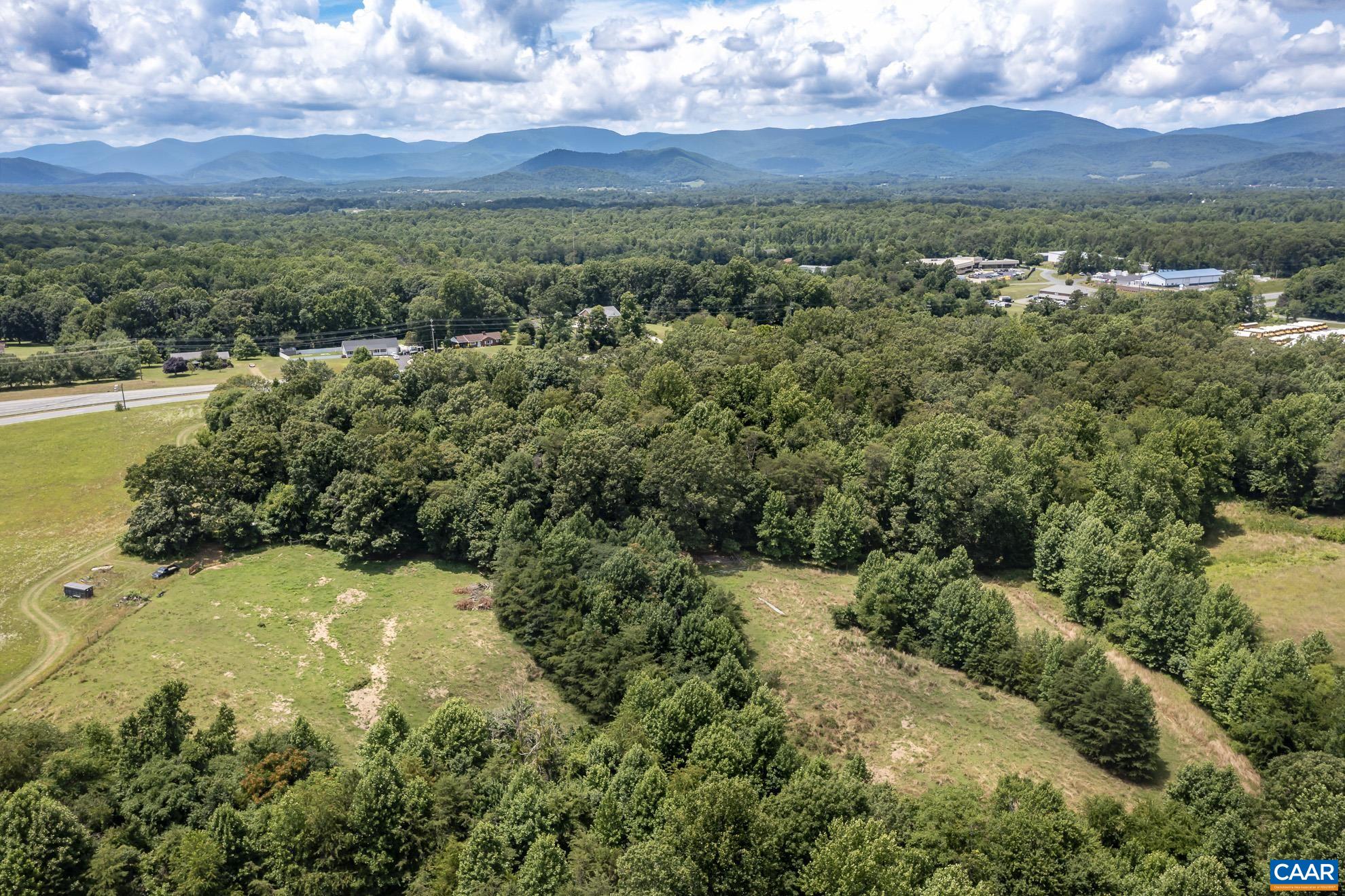 11697 Spotswood Trail Ruckersville, VA 22968 - Photo 15 of 53 a view of a city with mountains in the background