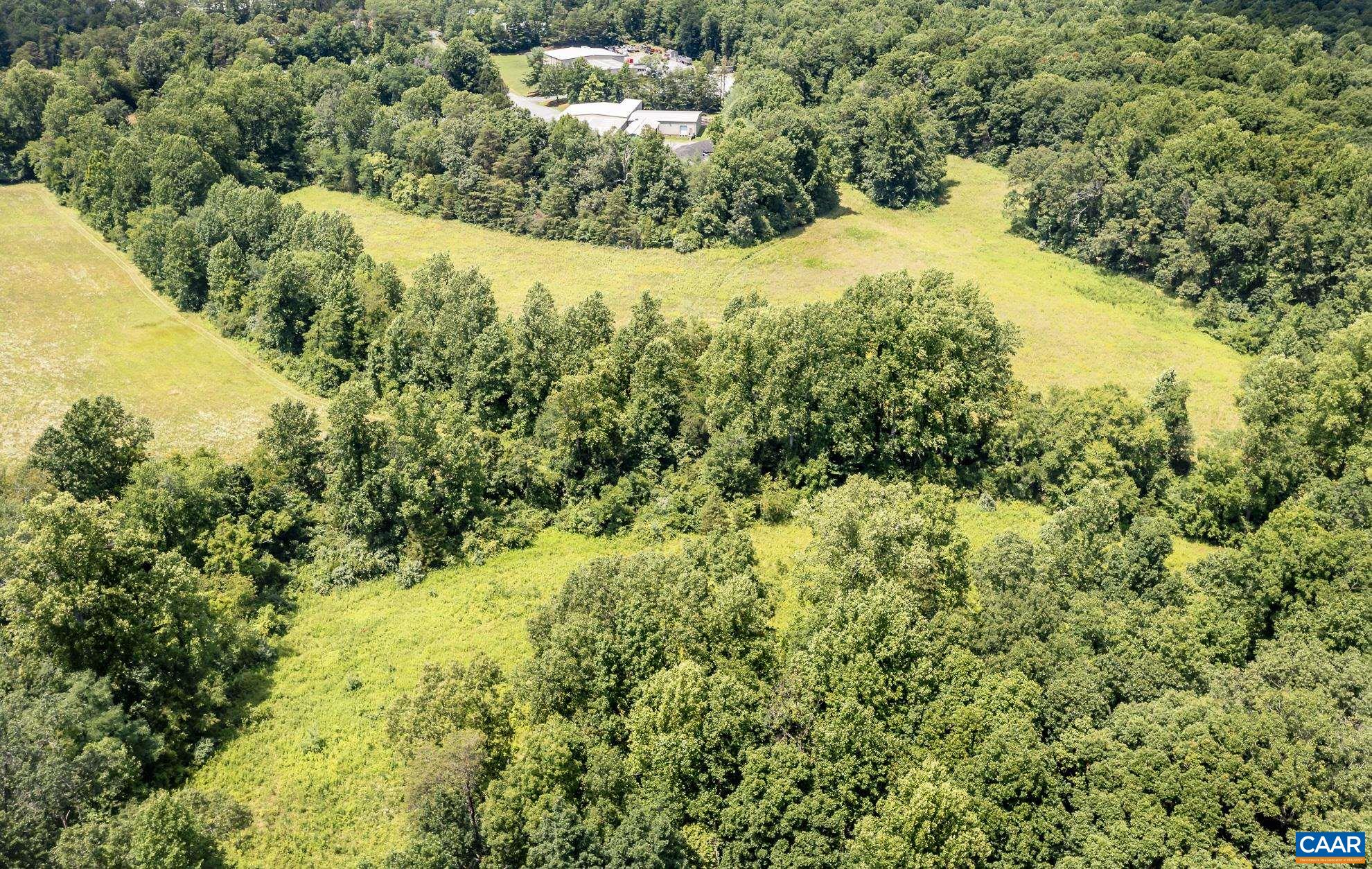 11697 Spotswood Trail Ruckersville, VA 22968 - Photo 20 of 53 a view of a lake with a mountain