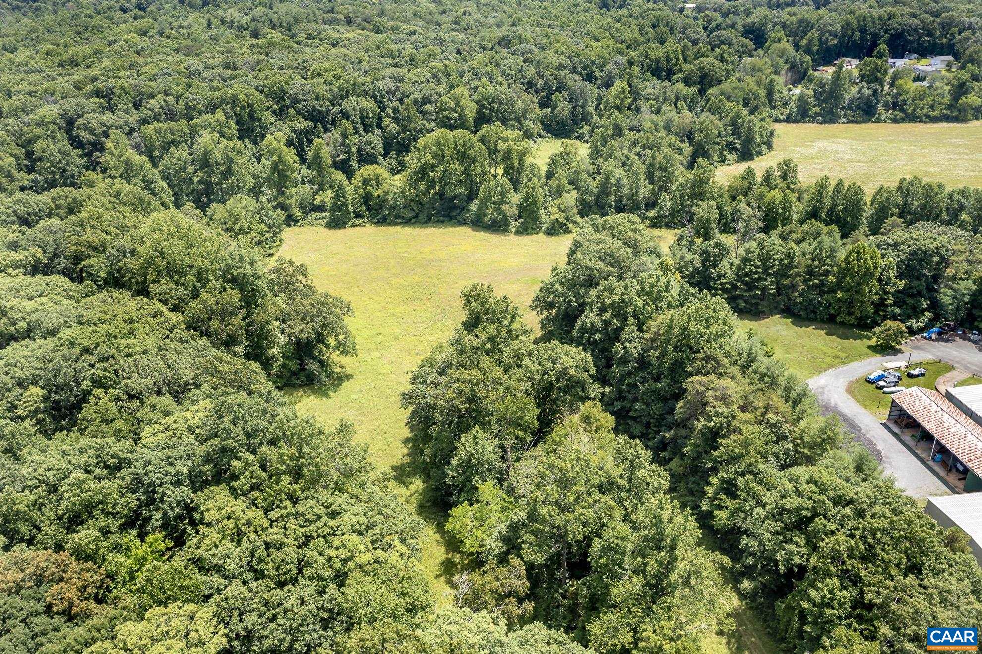 11697 Spotswood Trail Ruckersville, VA 22968 - Photo 28 of 53 an aerial view of residential house with outdoor space and trees all around
