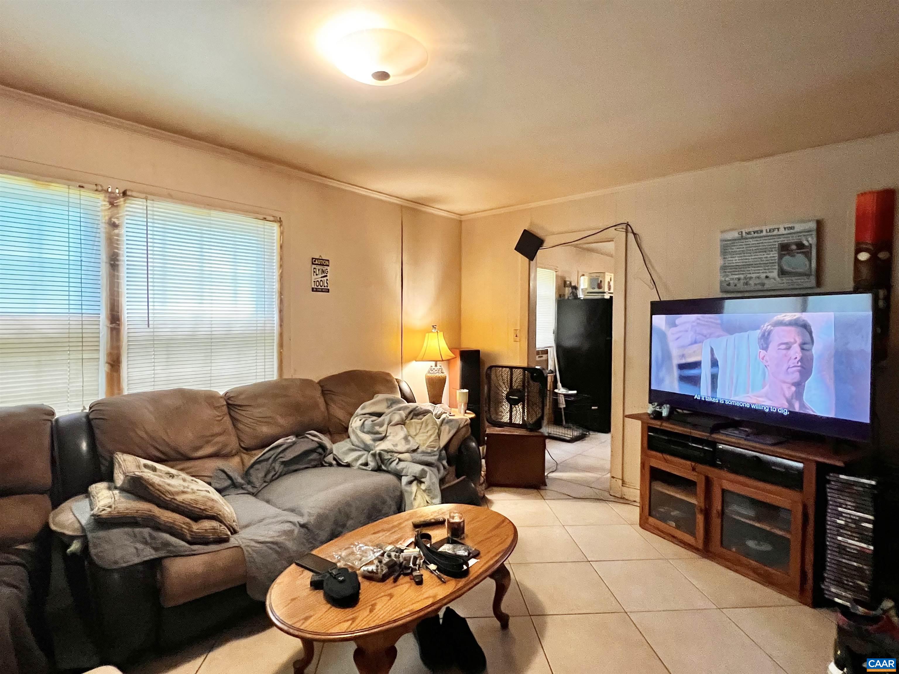 11697 Spotswood Trail Ruckersville, VA 22968 - Photo 38 of 53 a living room with furniture and a flat screen tv