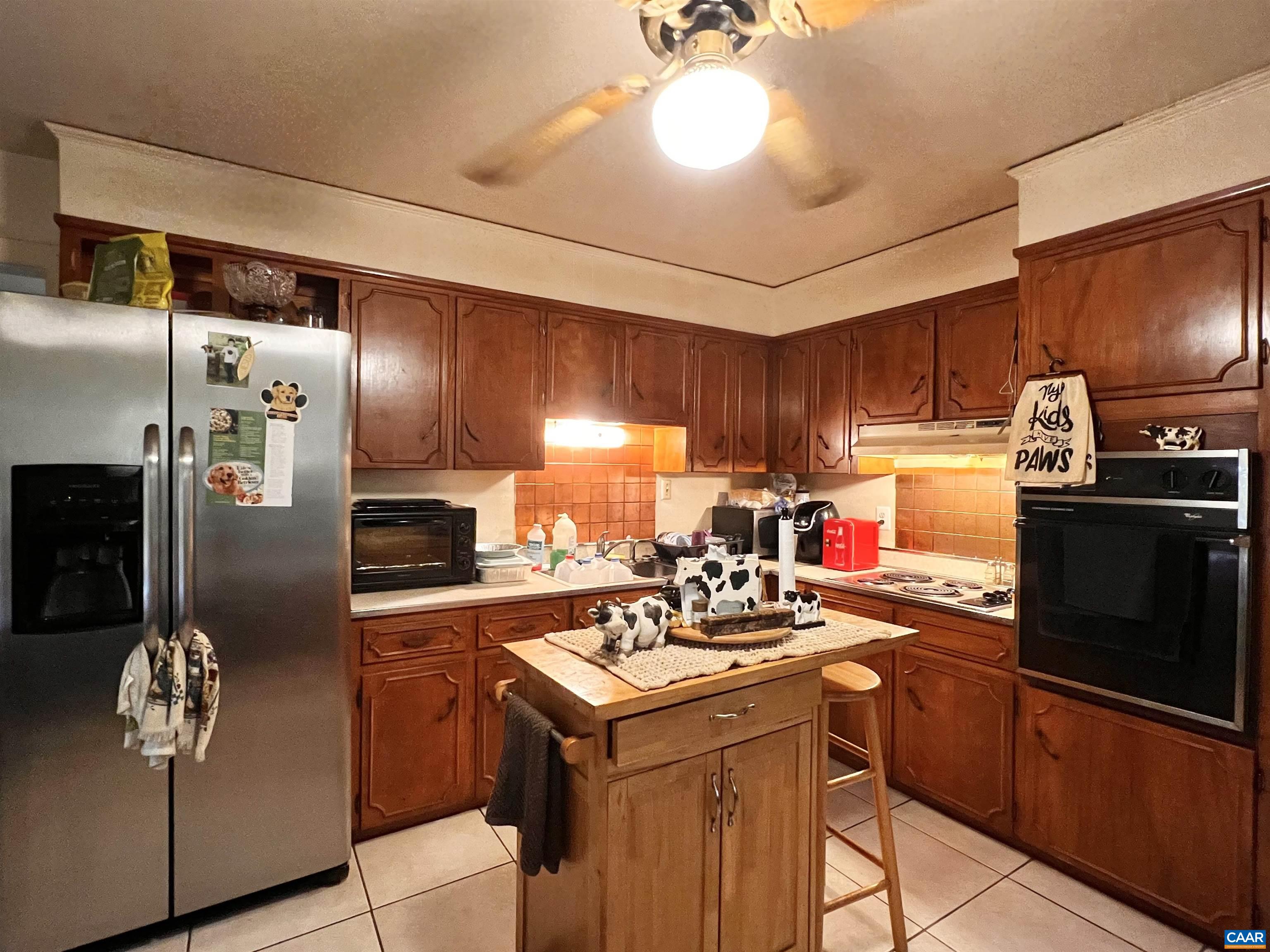 11697 Spotswood Trail Ruckersville, VA 22968 - Photo 51 of 53 a kitchen with a sink appliances and cabinets