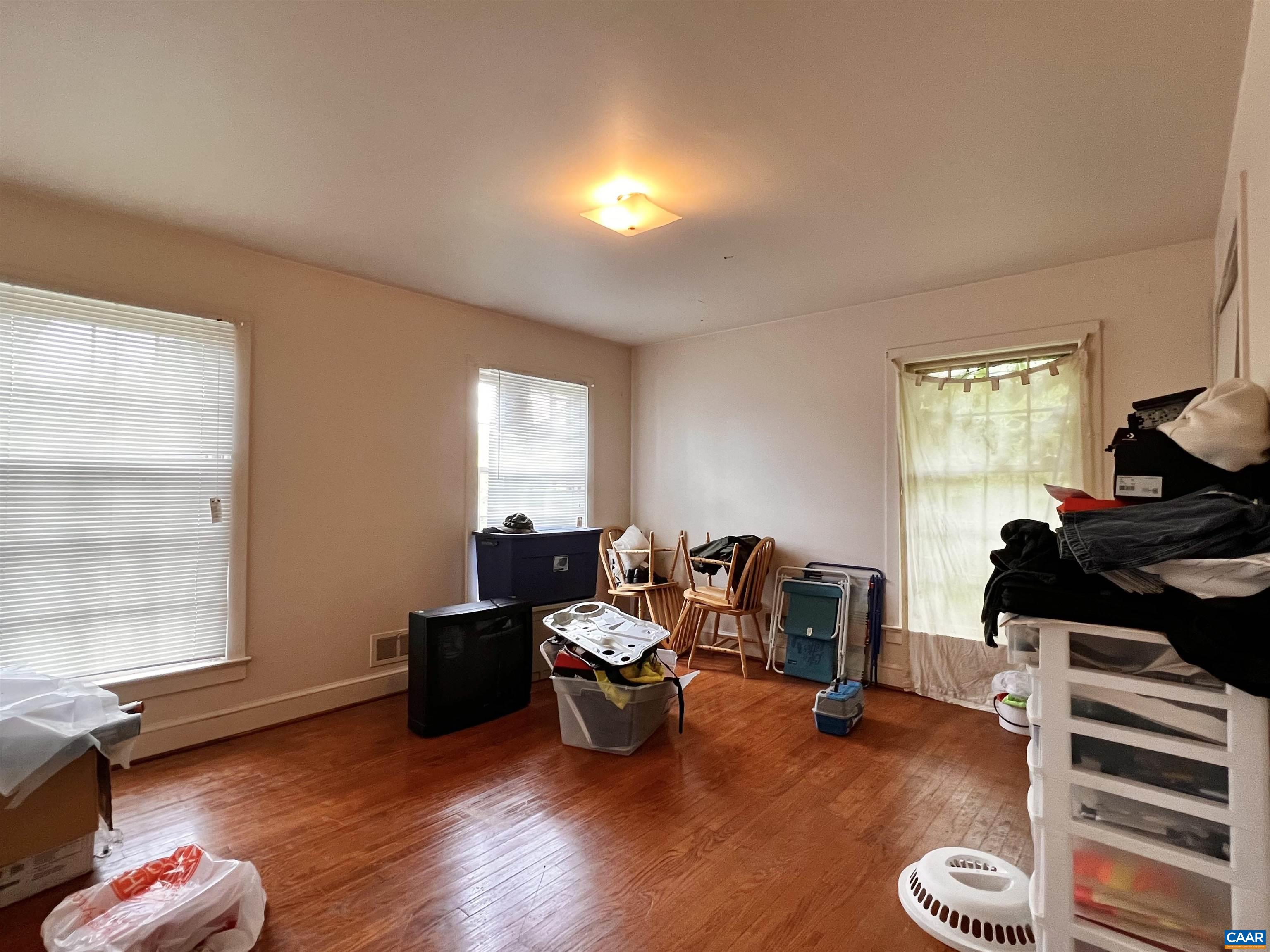 11697 Spotswood Trail Ruckersville, VA 22968 - Photo 52 of 53 a living room with furniture and a wooden floor
