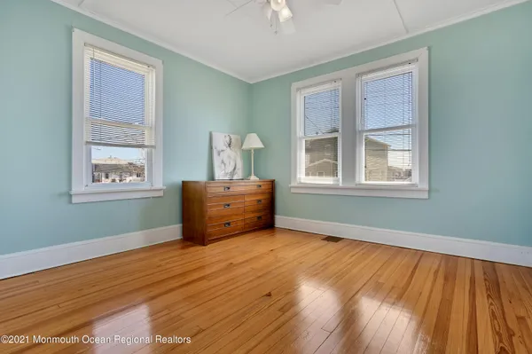 a room with window closet and a wooden floor