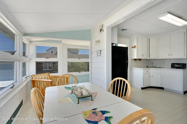 a living room with furniture fireplace and wooden floor