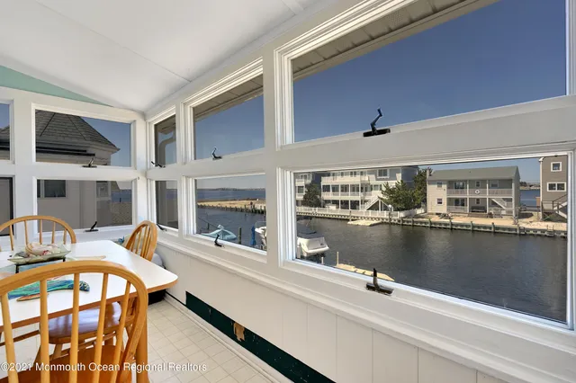 a view of a swimming pool with outdoor seating