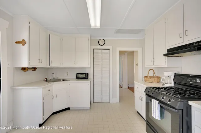 a kitchen with stainless steel appliances granite countertop a stove and a refrigerator