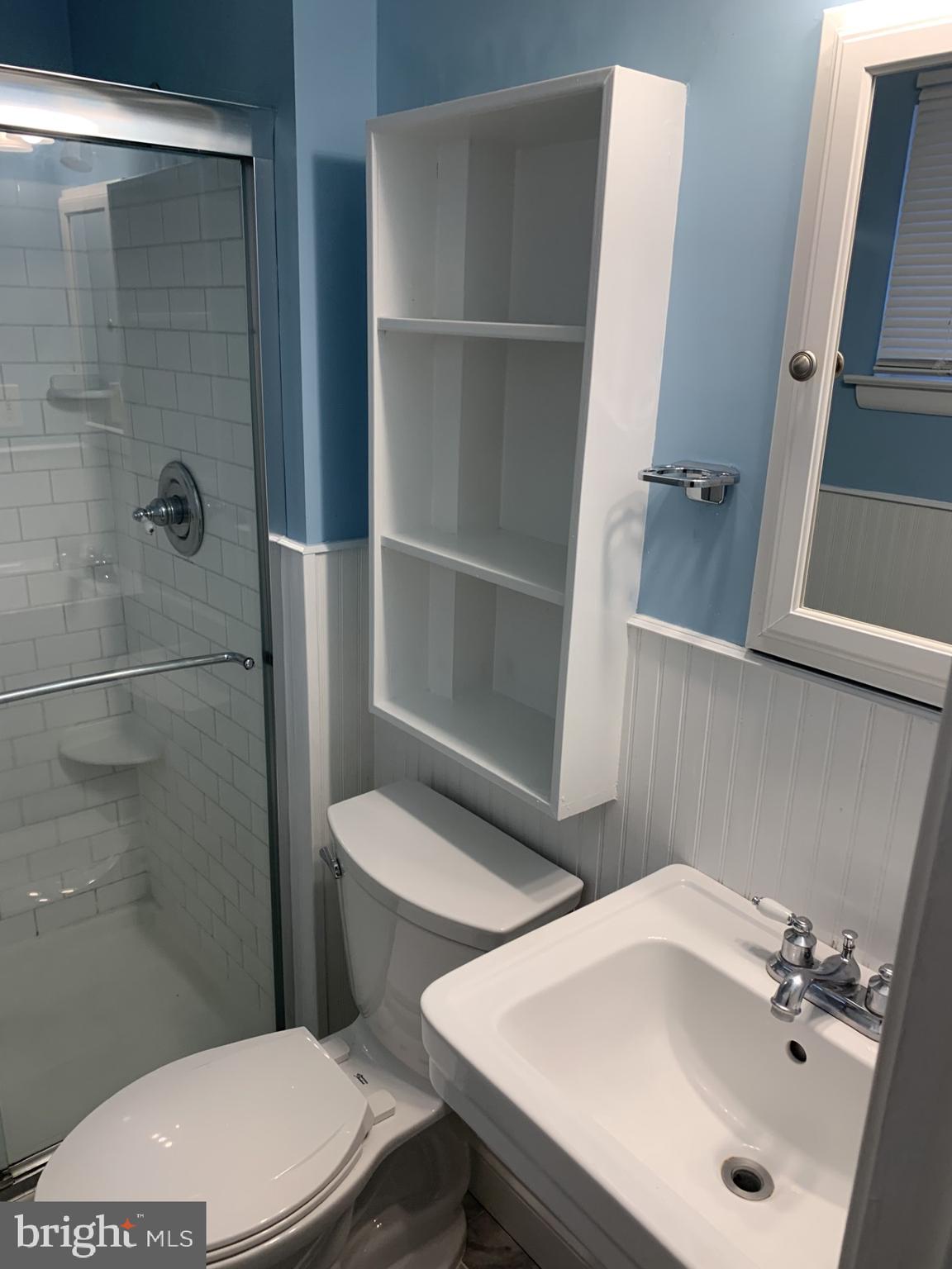 7004 Fitzpatrick Drive Laurel, MD 20707 - Photo 18 of 35 a bathroom with a sink a toilet and shower