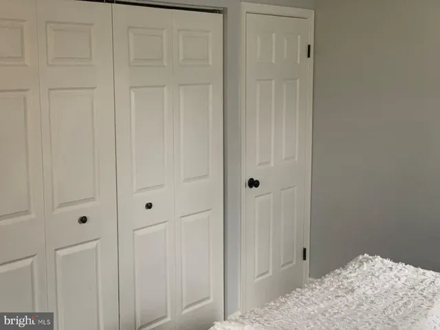 a view of a bedroom and hallway