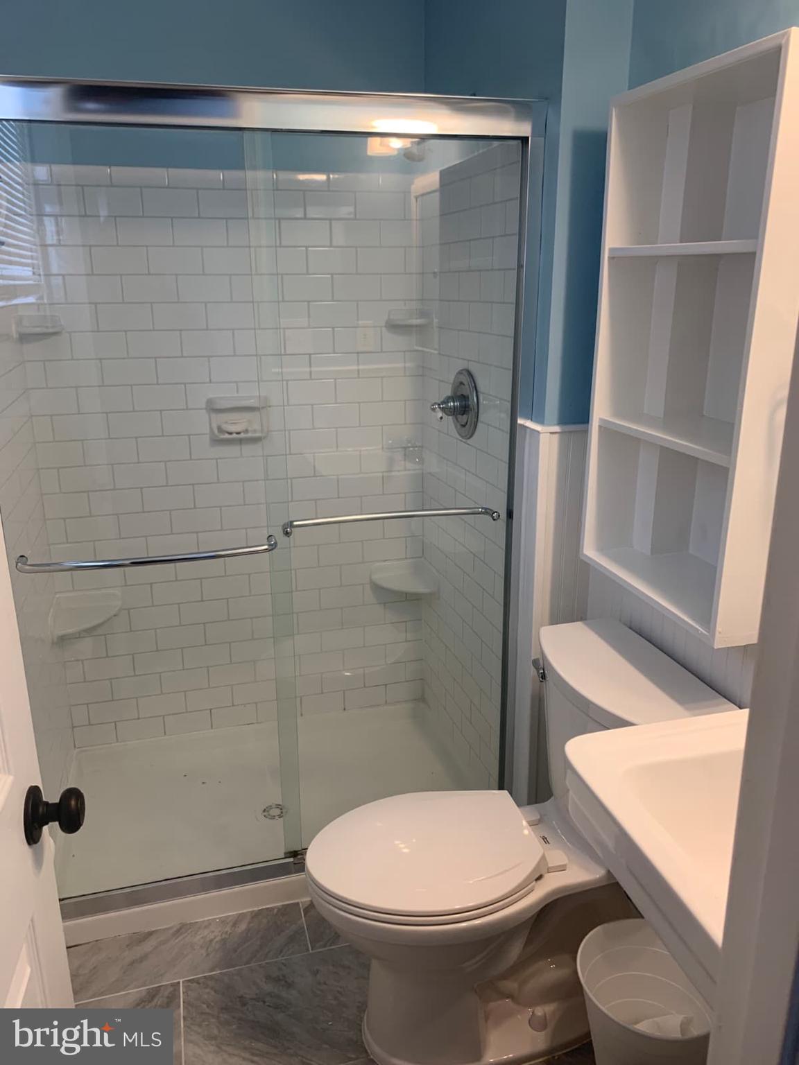 7004 Fitzpatrick Drive Laurel, MD 20707 - Photo 19 of 35 a bathroom with a toilet and a shower