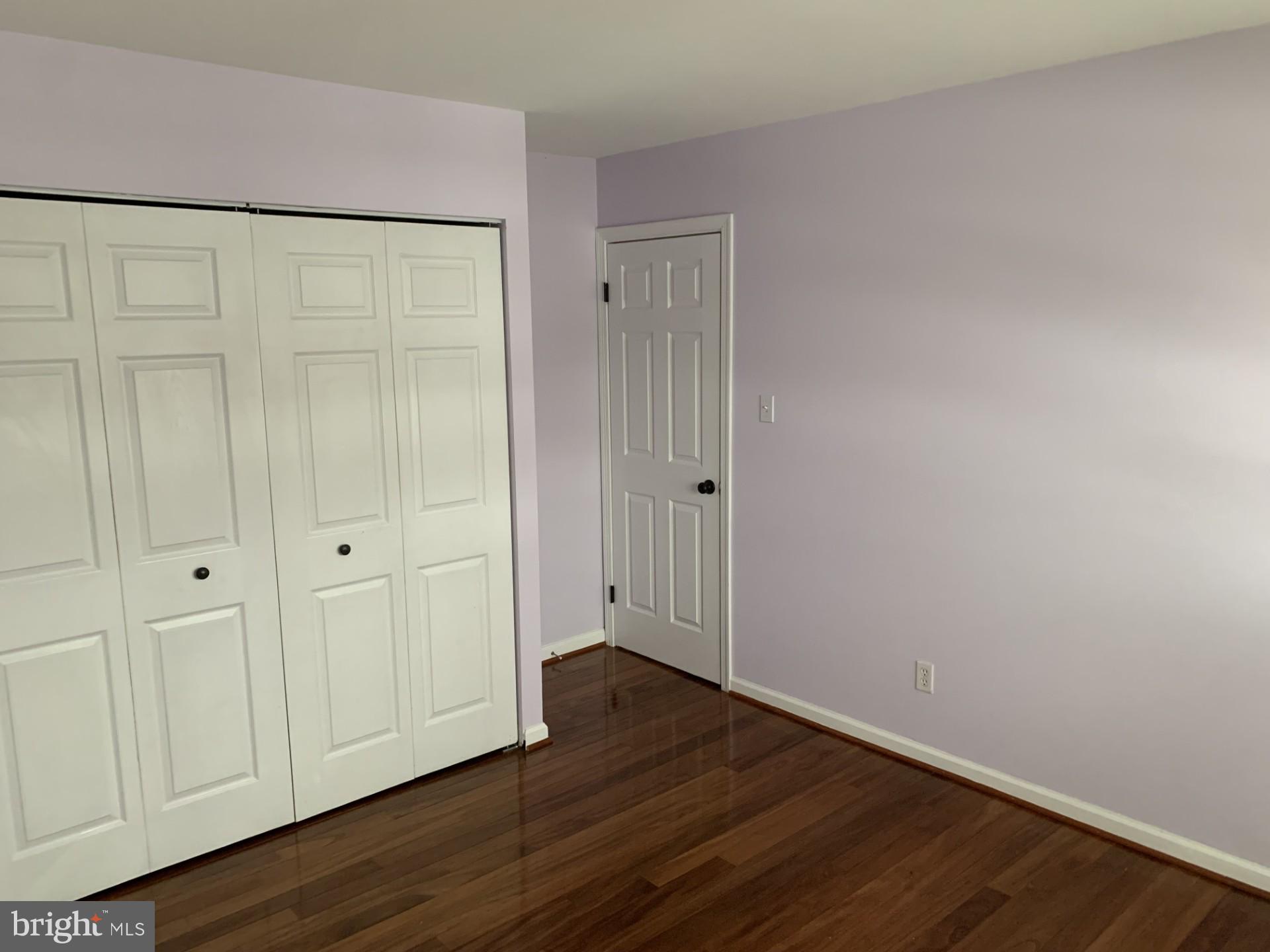 7004 Fitzpatrick Drive Laurel, MD 20707 - Photo 25 of 35 a view of an empty room with wooden floor