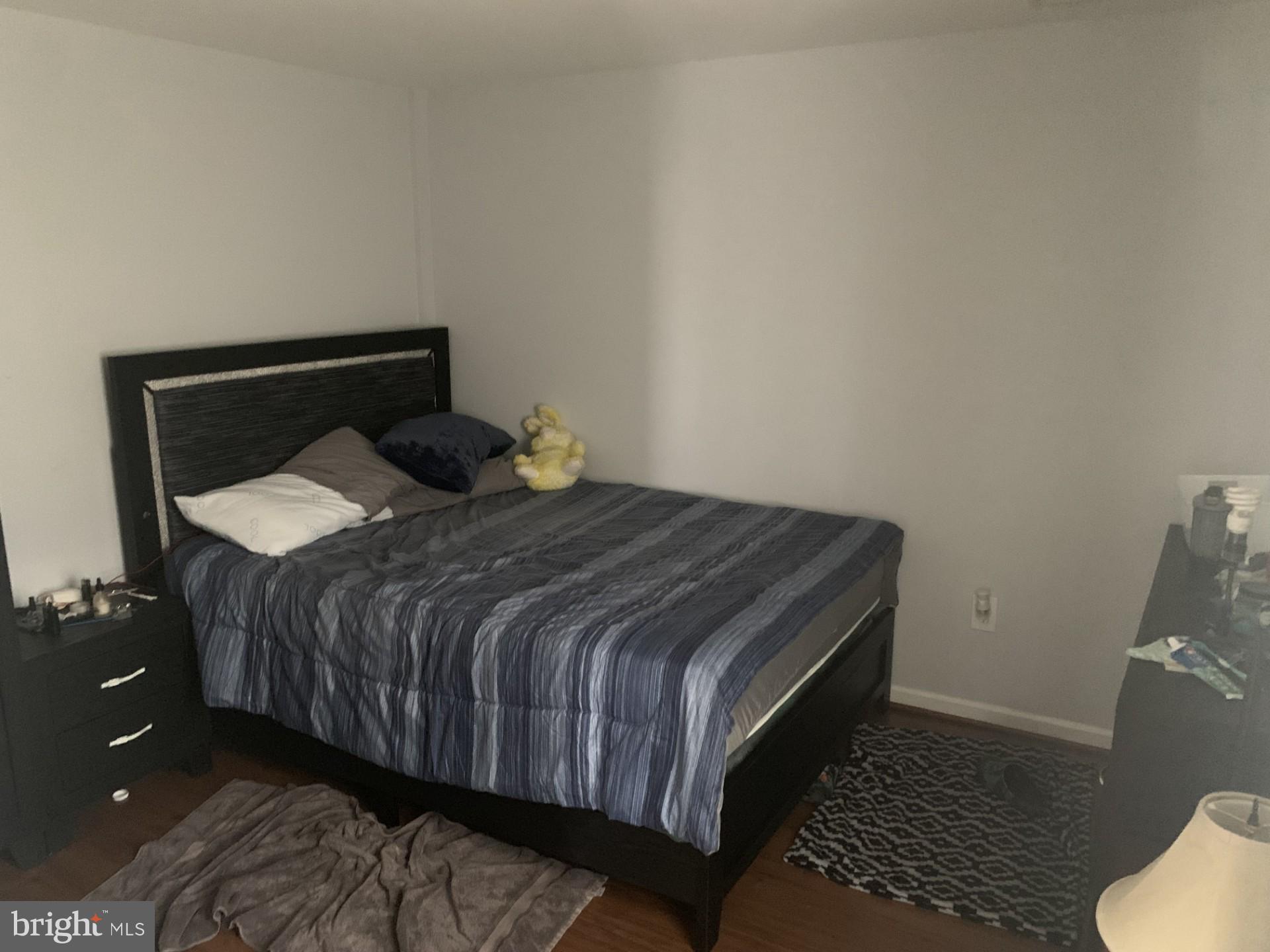 7004 Fitzpatrick Drive Laurel, MD 20707 - Photo 29 of 35 a bed sitting in a bedroom next to a small yard