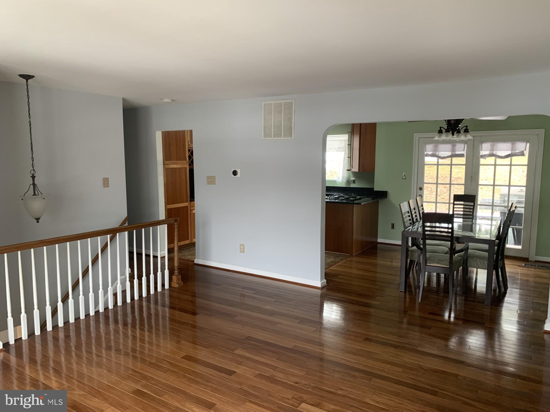 7004 Fitzpatrick Drive Laurel, MD 20707 - Photo 9 of 35 a view of a room with wooden floor and furniture