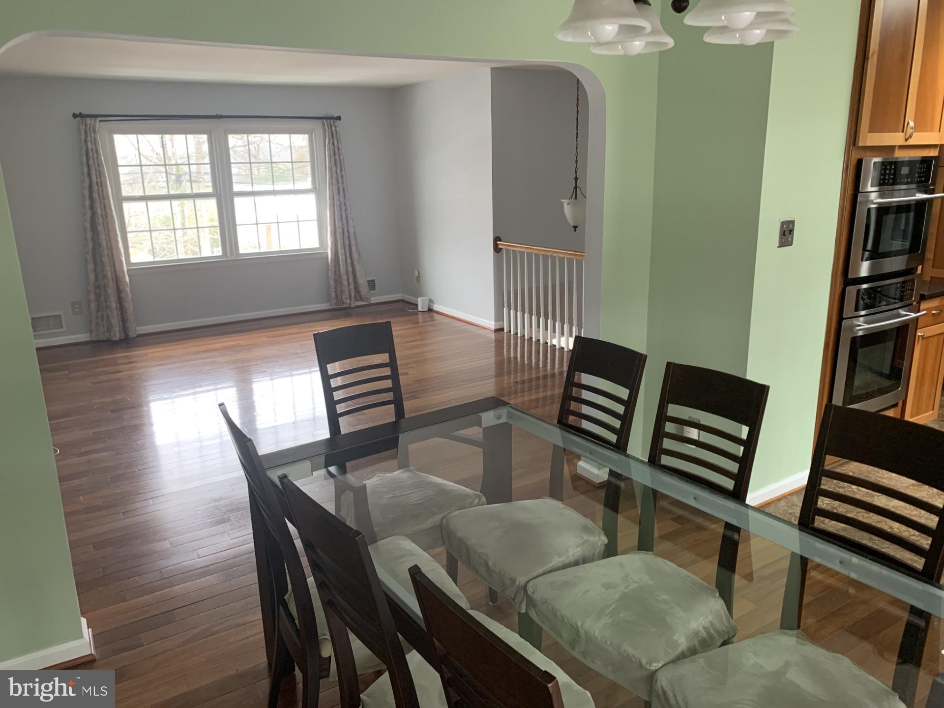 7004 Fitzpatrick Drive Laurel, MD 20707 - Photo 10 of 35 a view of a dining room with furniture and a book shelf