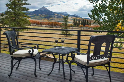 a view of a chairs and table in the terrace