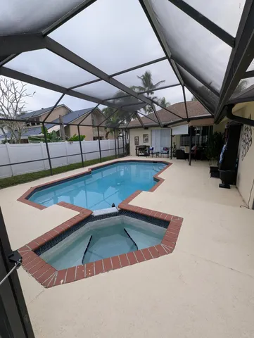 a view of a swimming pool with a patio