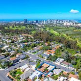 an aerial view of multiple houses with outdoor space