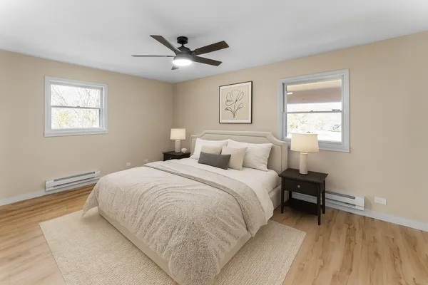 a bedroom with a bed and a window