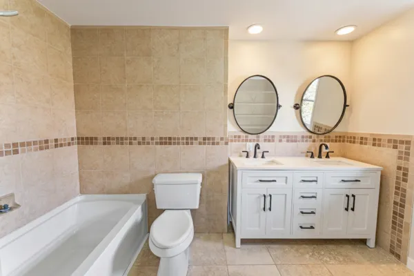 a bathroom with a toilet a sink and a bathtub