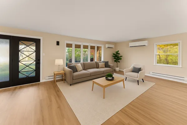 a living room with furniture and a window