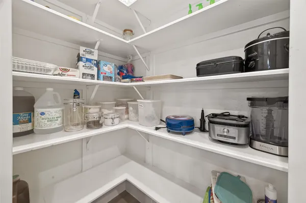 a kitchen with cabinets and window
