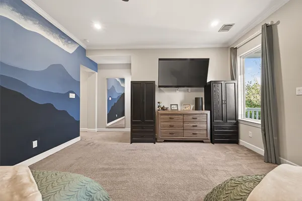 a room with furniture and a flat tv screen