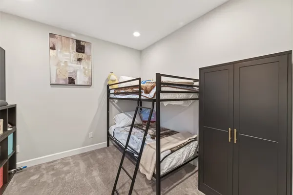 a view of a hallway with paintings on the wall