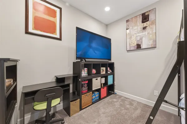 a view of a workspace with furniture