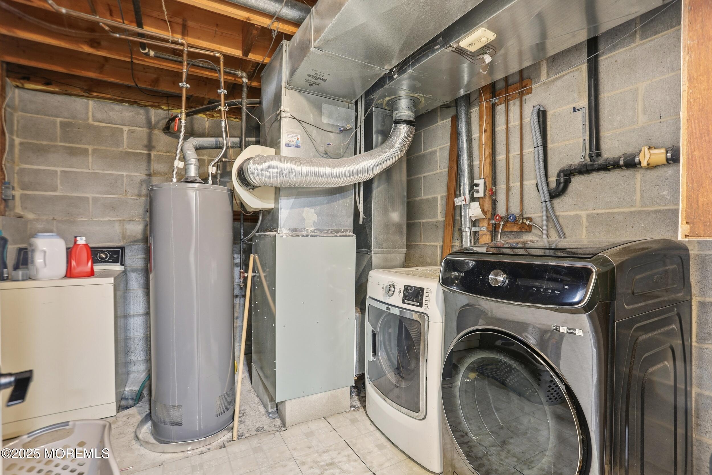 28 Bronia Street Howell, NJ 07731 - Photo 32 of 34 a view of a storage & utility room with washer and dryer