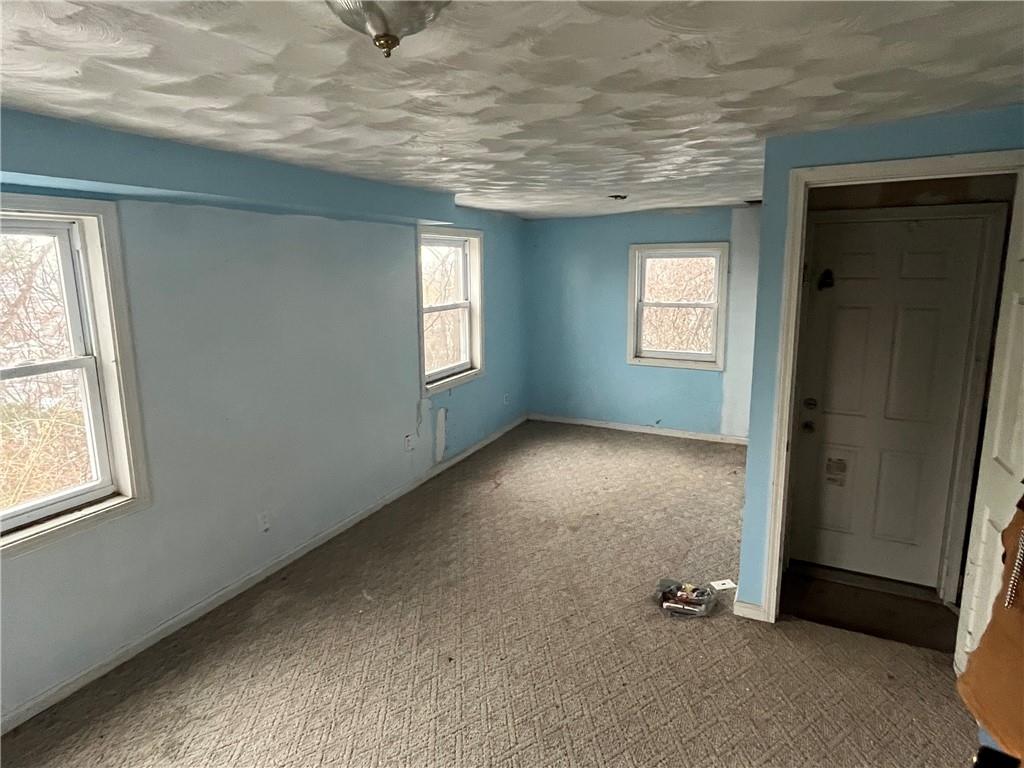 611 Singer Place Pittsburgh, PA 15221 - Photo 4 of 7 an empty room with windows