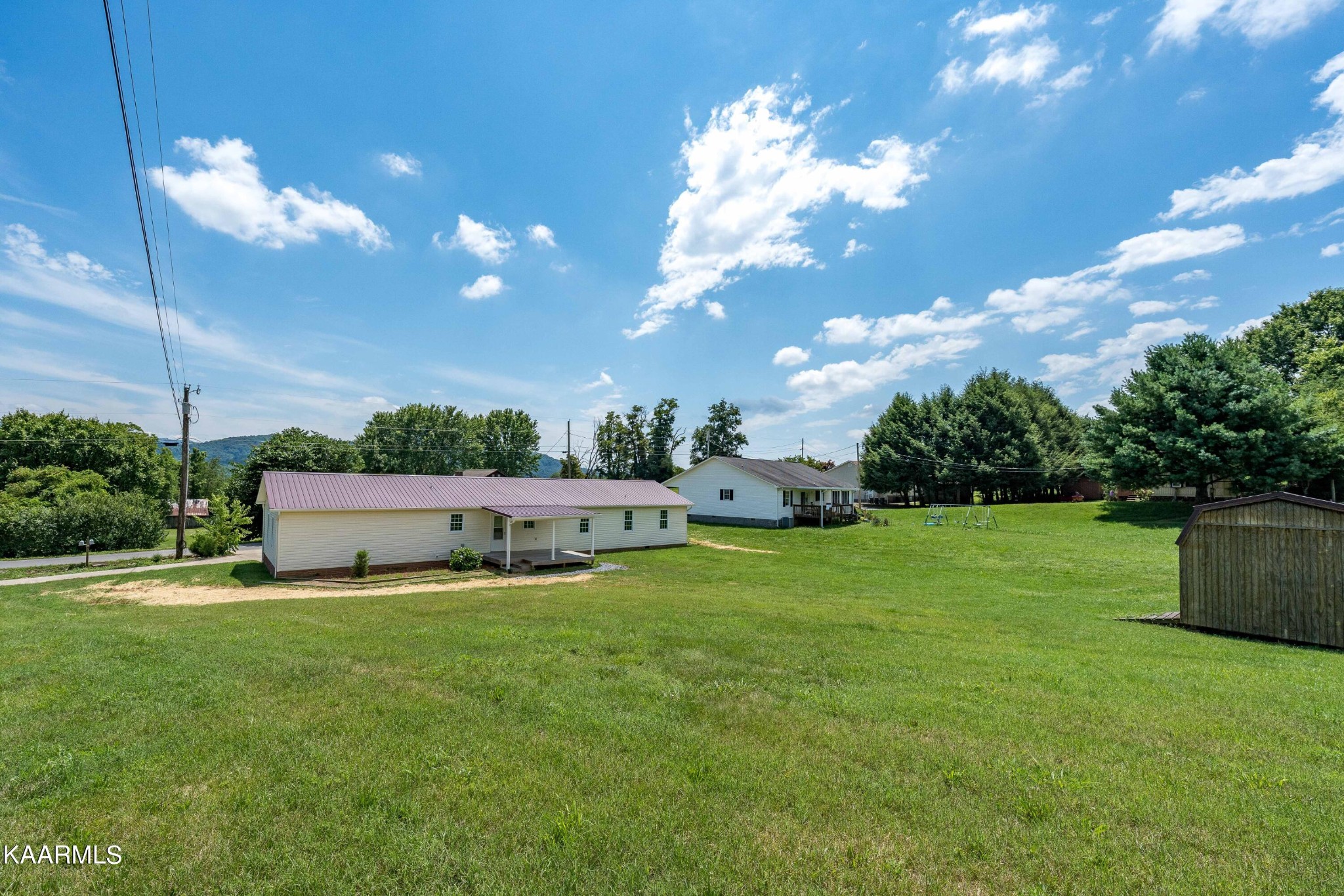 212 George Bowers Road Elizabethton, TN 37643 - Photo 12 of 49 a view of a house with a big yard