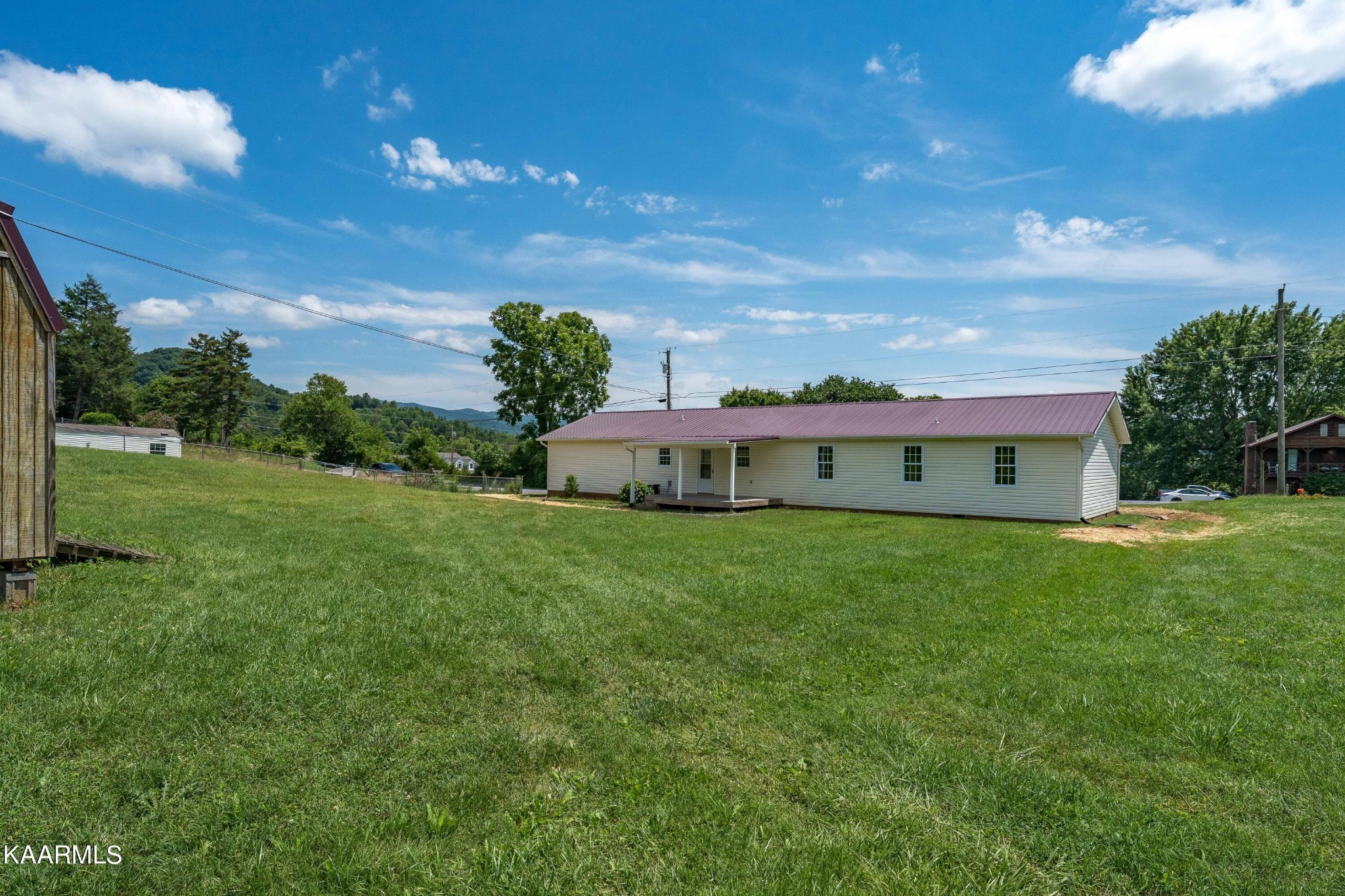 212 George Bowers Road Elizabethton, TN 37643 - Photo 16 of 49 a view of a house with a big yard