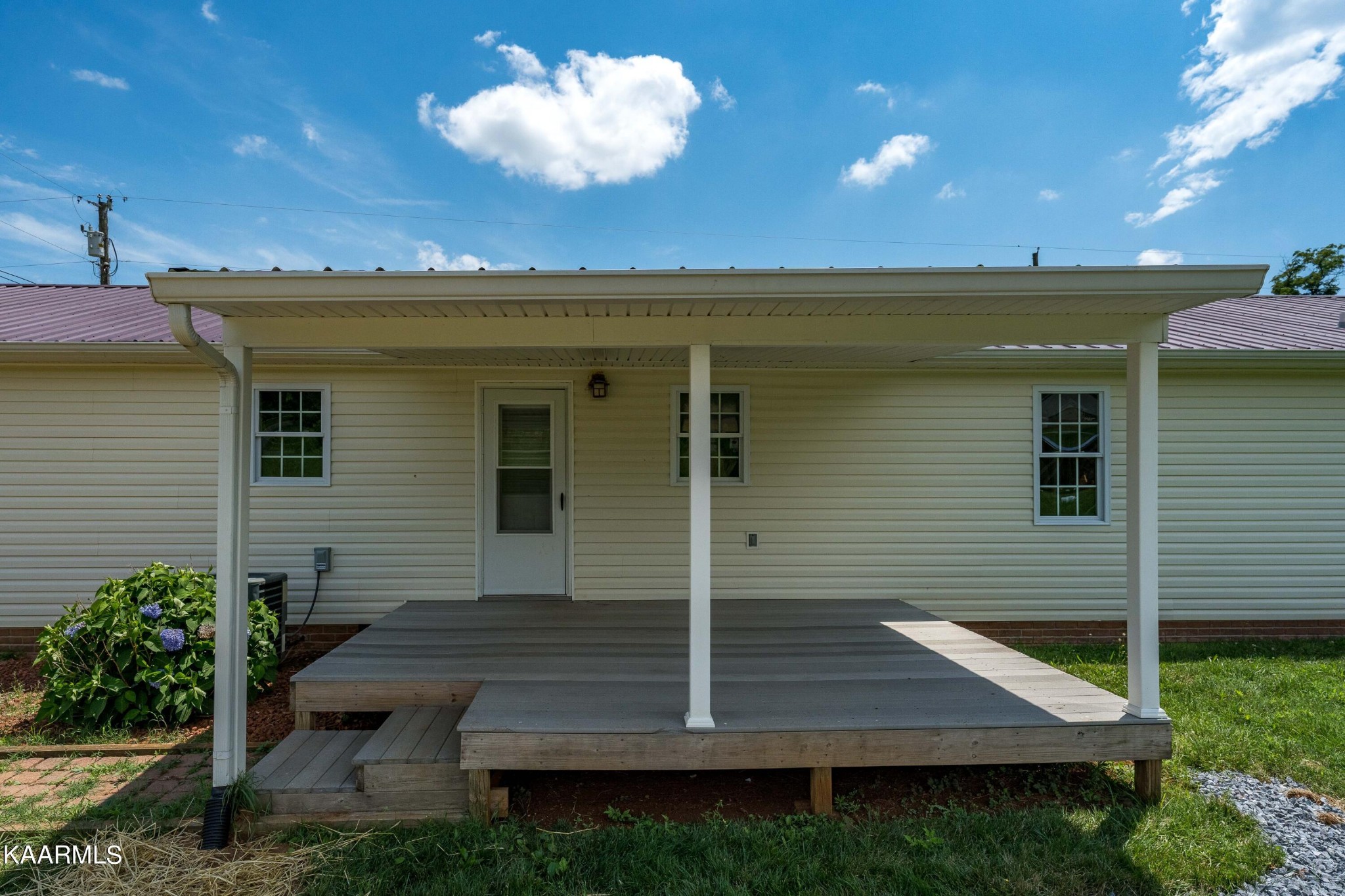 212 George Bowers Road Elizabethton, TN 37643 - Photo 18 of 49 a view of a house with a chairs