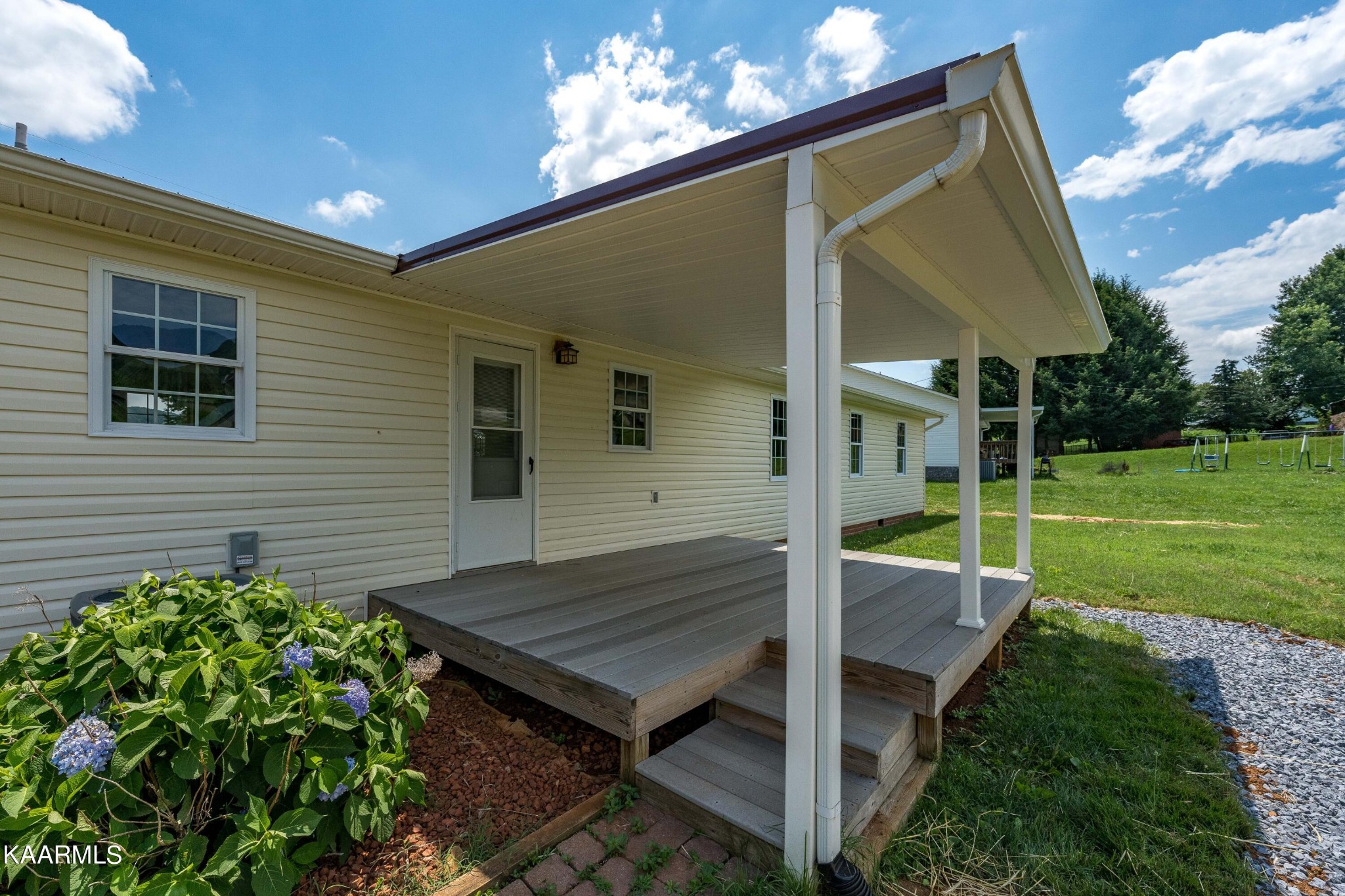 212 George Bowers Road Elizabethton, TN 37643 - Photo 19 of 49 a view of backyard with a garden and entertaining space