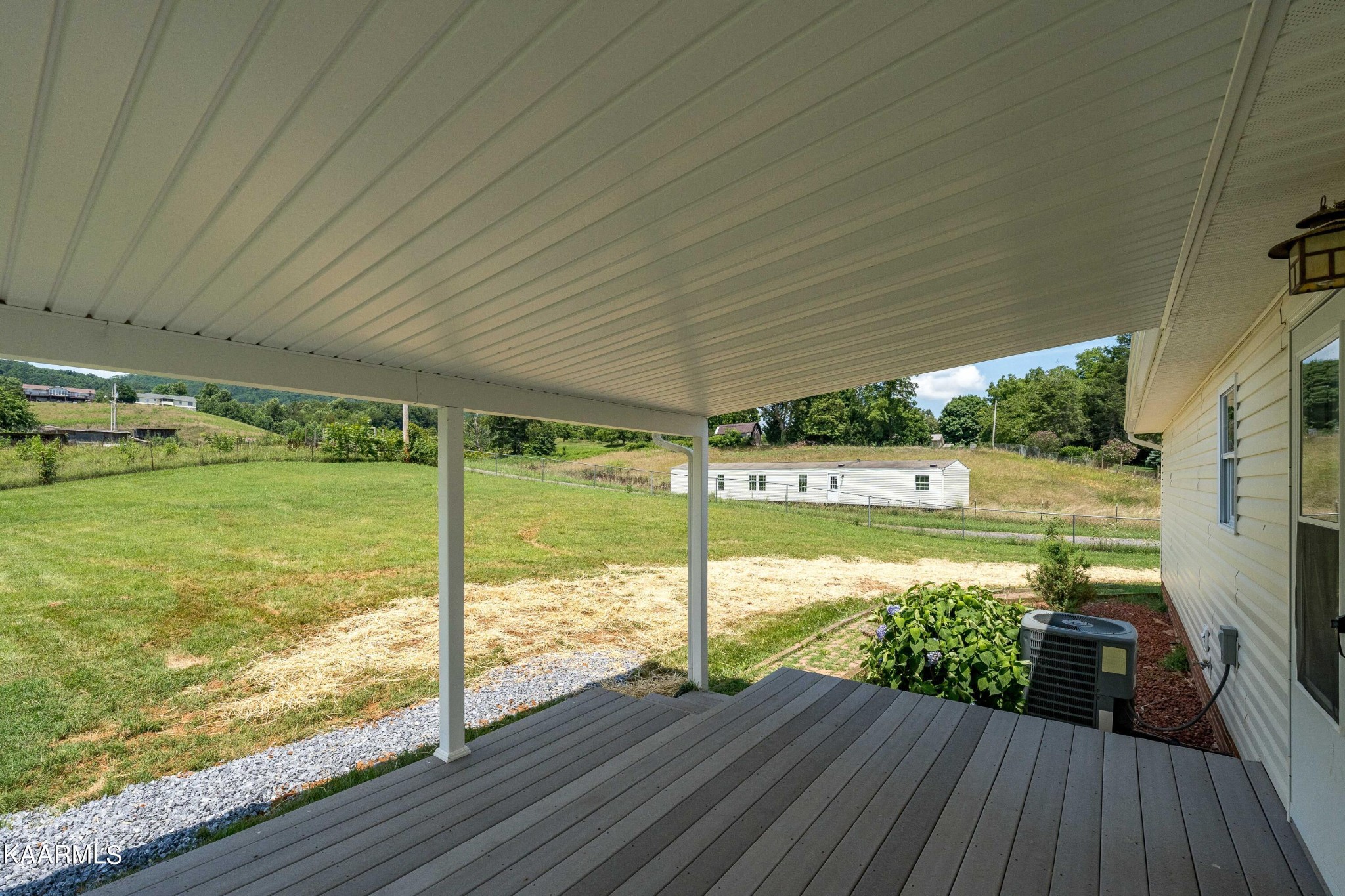 212 George Bowers Road Elizabethton, TN 37643 - Photo 21 of 49 a view of a deck with wooden floor and outdoor space