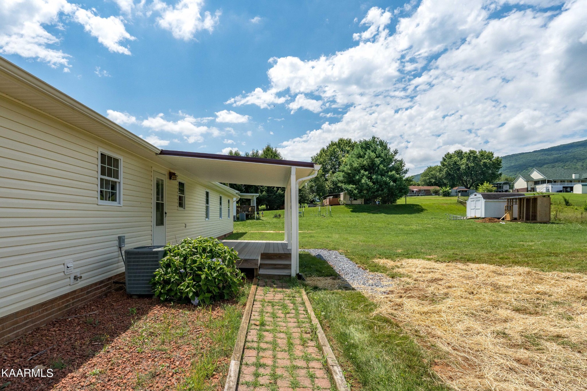 212 George Bowers Road Elizabethton, TN 37643 - Photo 23 of 49 a view of a house with backyard