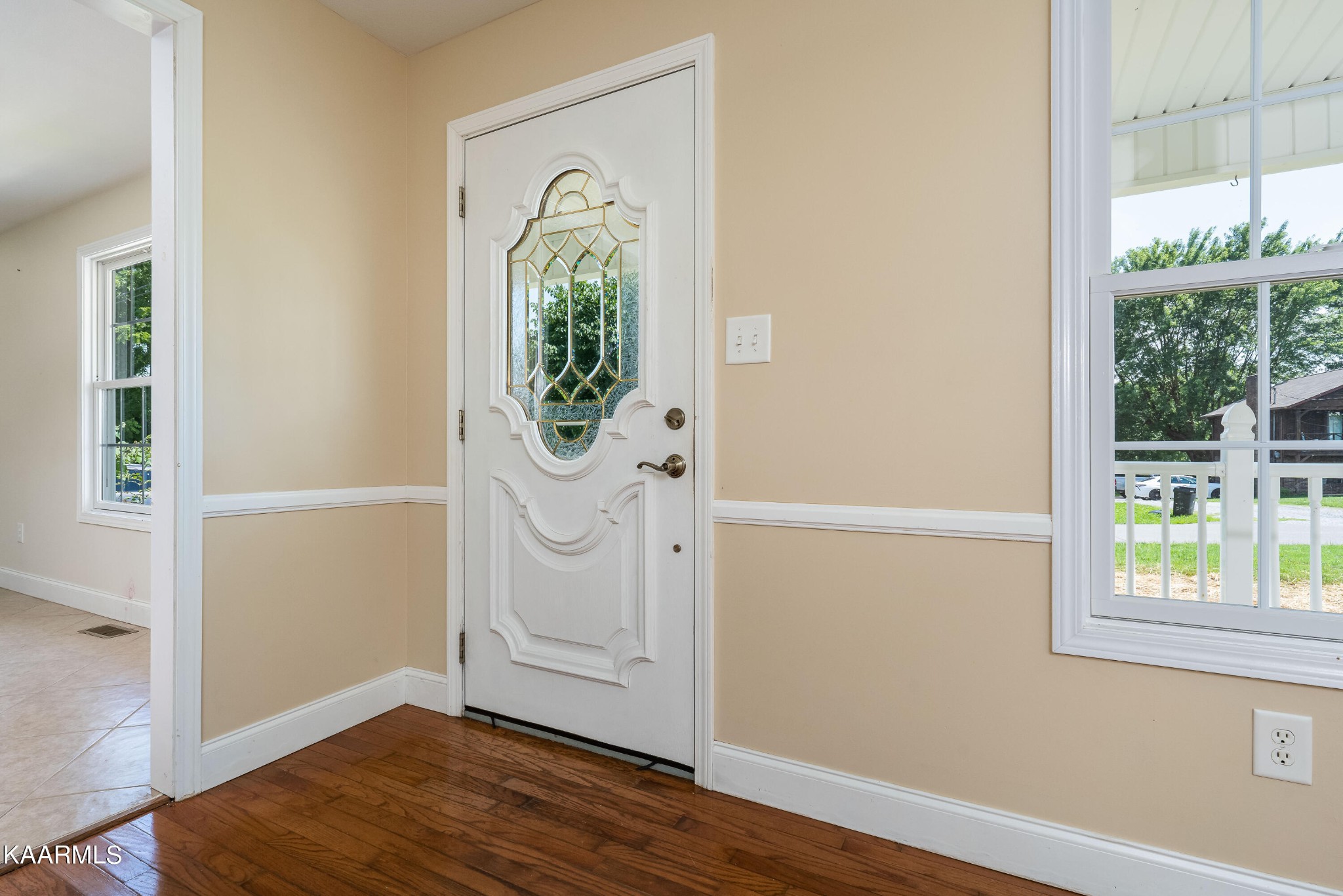 212 George Bowers Road Elizabethton, TN 37643 - Photo 24 of 49 an empty room with wooden floor and windows