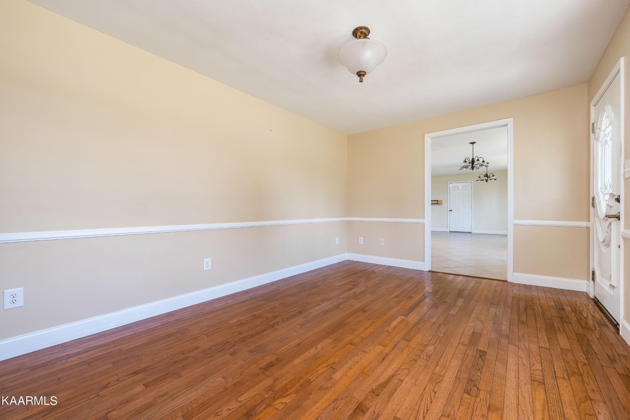 212 George Bowers Road Elizabethton, TN 37643 - Photo 27 of 49 an empty room with wooden floor and windows