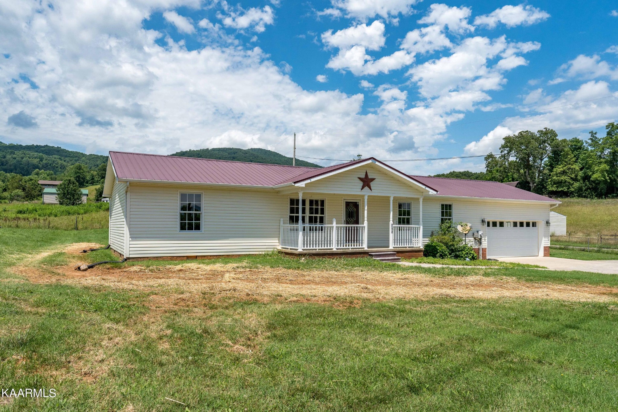 212 George Bowers Road Elizabethton, TN 37643 - Photo 3 of 49 a front view of house with yard and green space