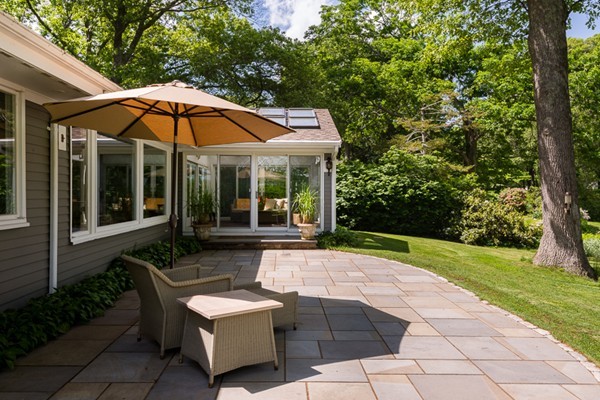 190 Damons Point Road Marshfield, MA 02050 - Photo 21 of 23 a view of a house with backyard sitting area and garden