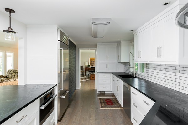 190 Damons Point Road Marshfield, MA 02050 - Photo 4 of 23 a kitchen with granite countertop a sink a stove and cabinets