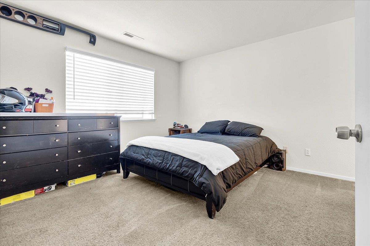 715 Skinner Street Soledad, CA 93960 - Photo 17 of 35 a bedroom with a bed and window